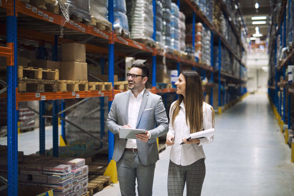 warehouse-workers-talking-about-logistics-distribution