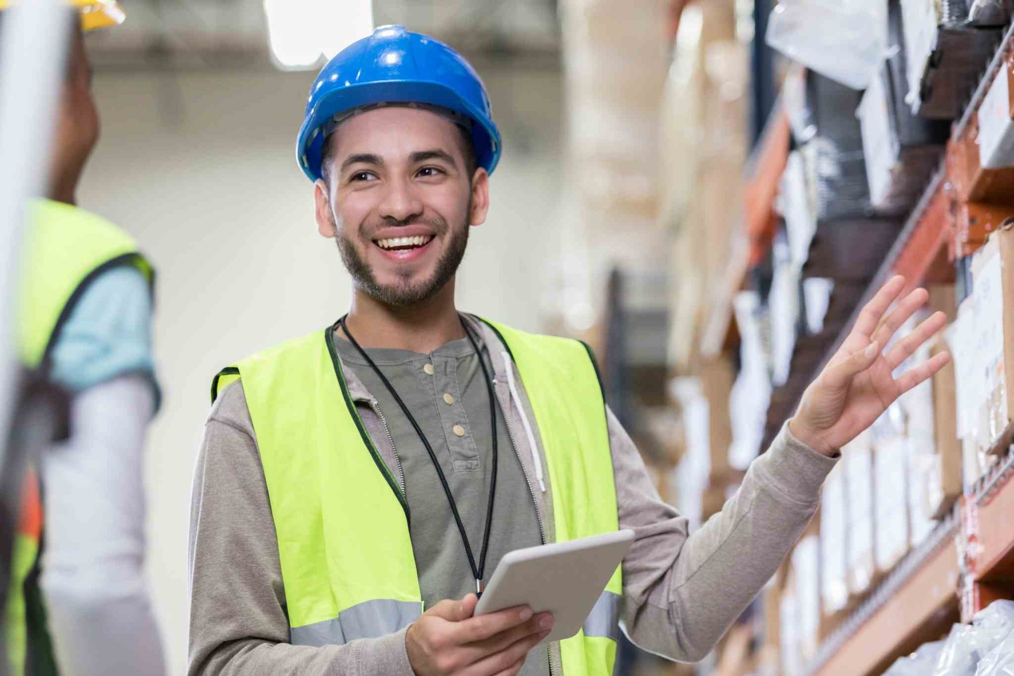 warehouse associate talking to co-worker