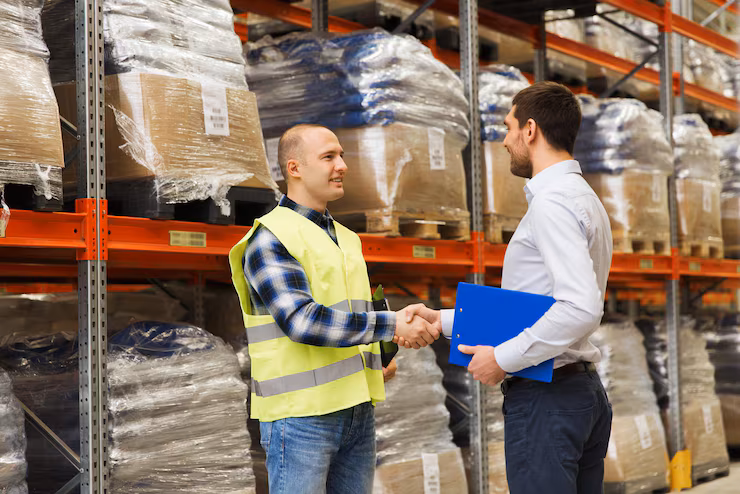 business men with clipboard making deal warehouse